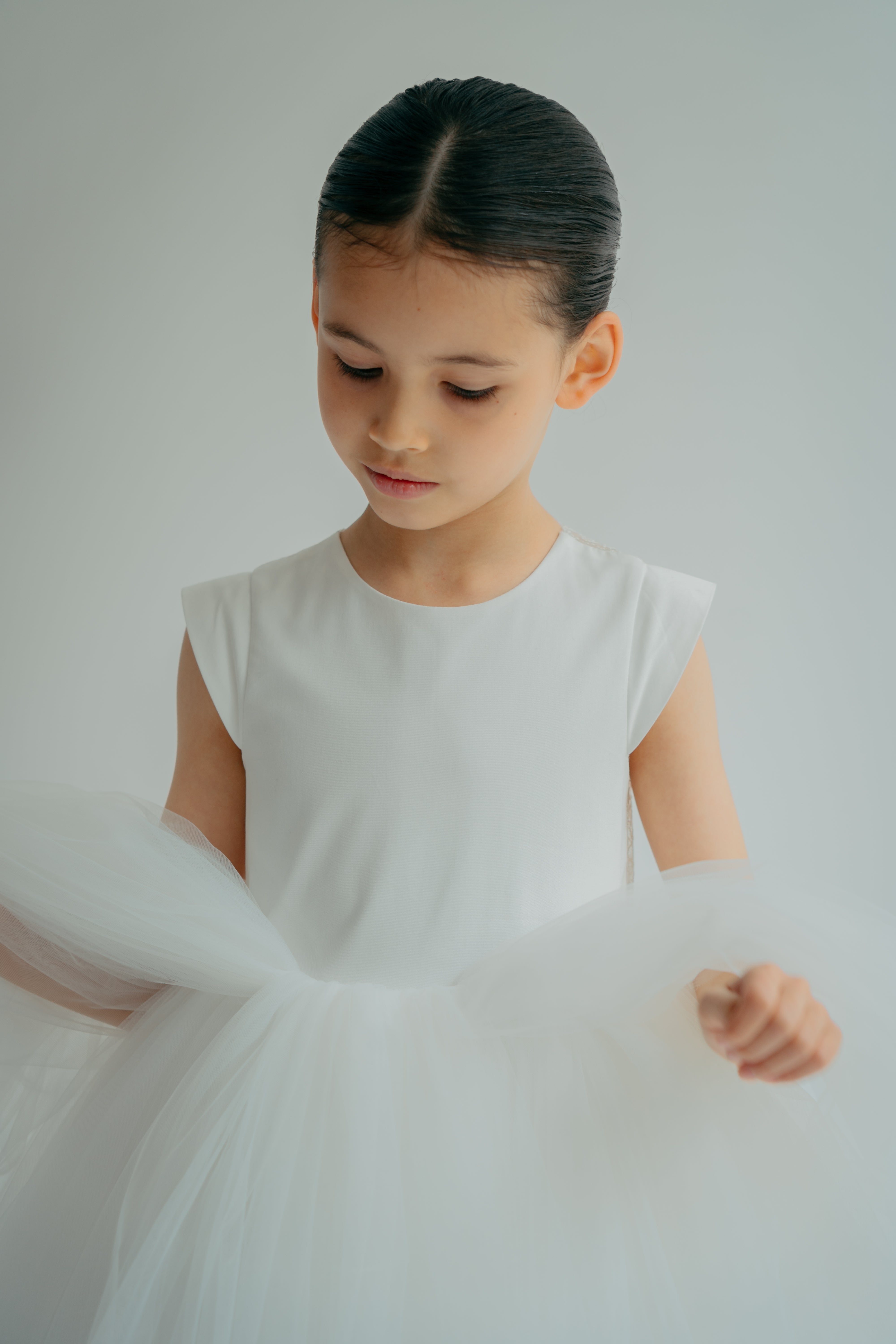 Girl admiring tulle details on her princess dress
